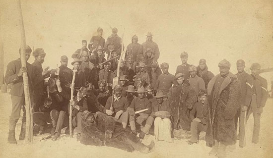 Buffalo soldiers of the 25th Infantry, some wearing buffalo robes, at Fort Keogh, Montana. (Photo By Tiana Waters)