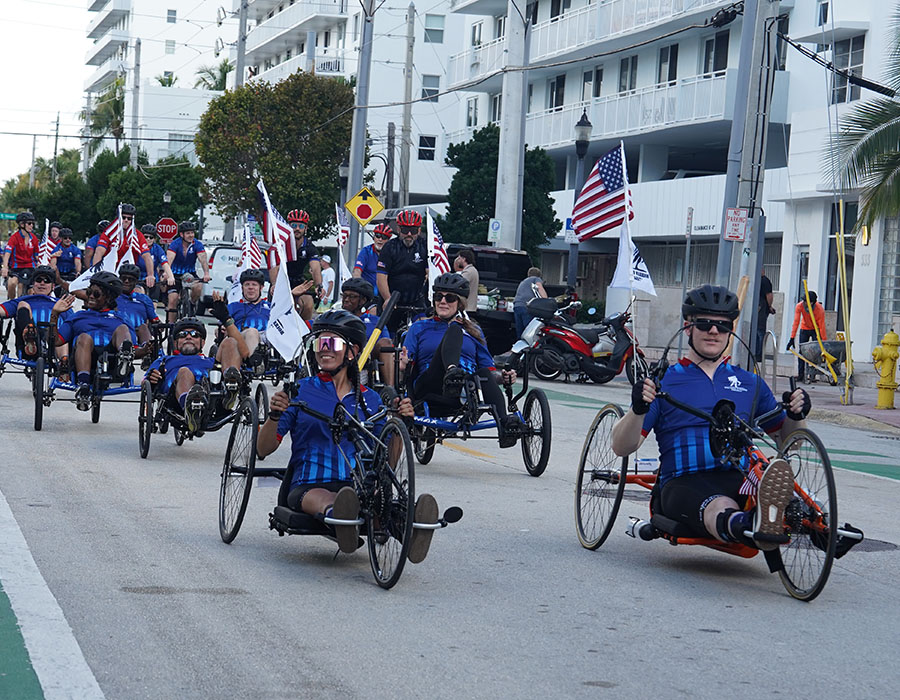 Warriors ride adaptive bicycles through the streets on Miami during Soldier Ride.
