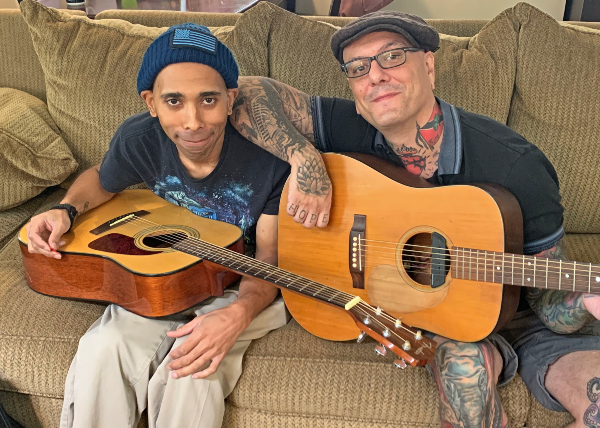 Navy veteran Marquise Morris (left), receives music therapy at home through Wounded Warrior Project's Independence Program.