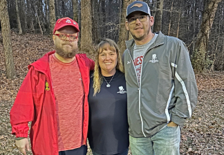 Image of Rob Caudill, Dana Hutson, and David Long at an in-person peer support group meeting in North Carolina. David now joins the group remotely from Kuwait. 