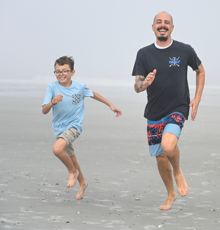National Guard veteran running with son