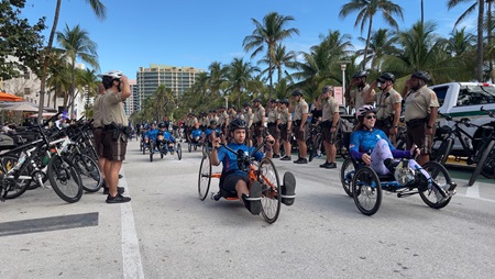 Soldiers are saluted by local law enforcement at the starting line of Soldier Ride Miami Key-West.