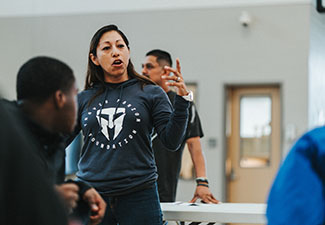 Veteran Lupita Hernandez mentors young people through Travis Manion Foundation's Character Does Matter program.