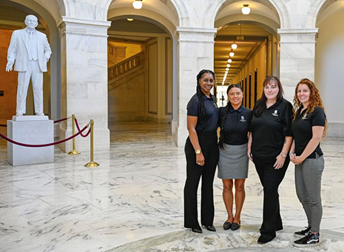 Army veteran Rana Clark (right) stands with other women warriors during advocacy efforts to push for legislation that benefits veterans. 